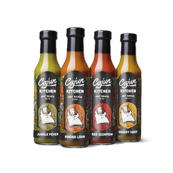 A group of four hot sauces flavors presenting variations on a main label design