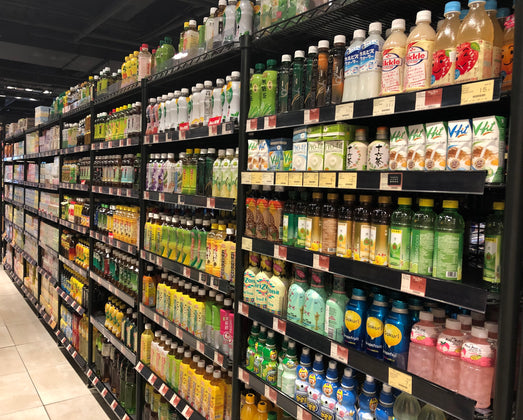 The interior of a store showing an array of label packaged products on store shelves