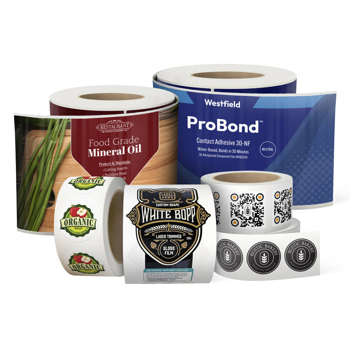 A group of roll printed label rolls in various sizes and diecut shapes